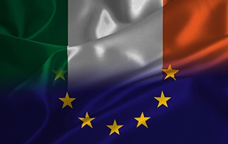 Business meeting discussing EU Platform Workers Directive compliance in Ireland