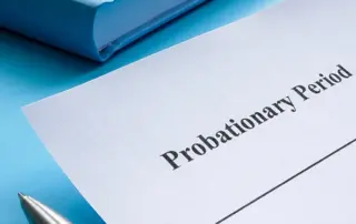 HR manager reviewing employee probation period documentation and employment law changes