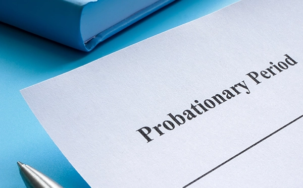 HR manager reviewing employee probation period documentation and employment law changes