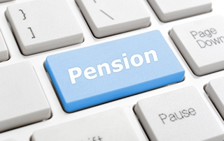 Payroll manager reviewing employee pension auto-enrolment records in Ireland