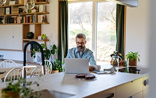 Irish business owner reviewing contractor agreements and employment status documents